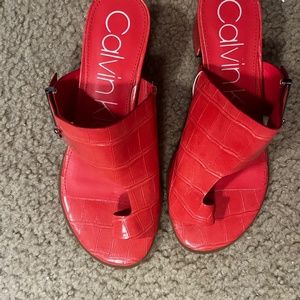 Red Calvin Klein slip on sandals